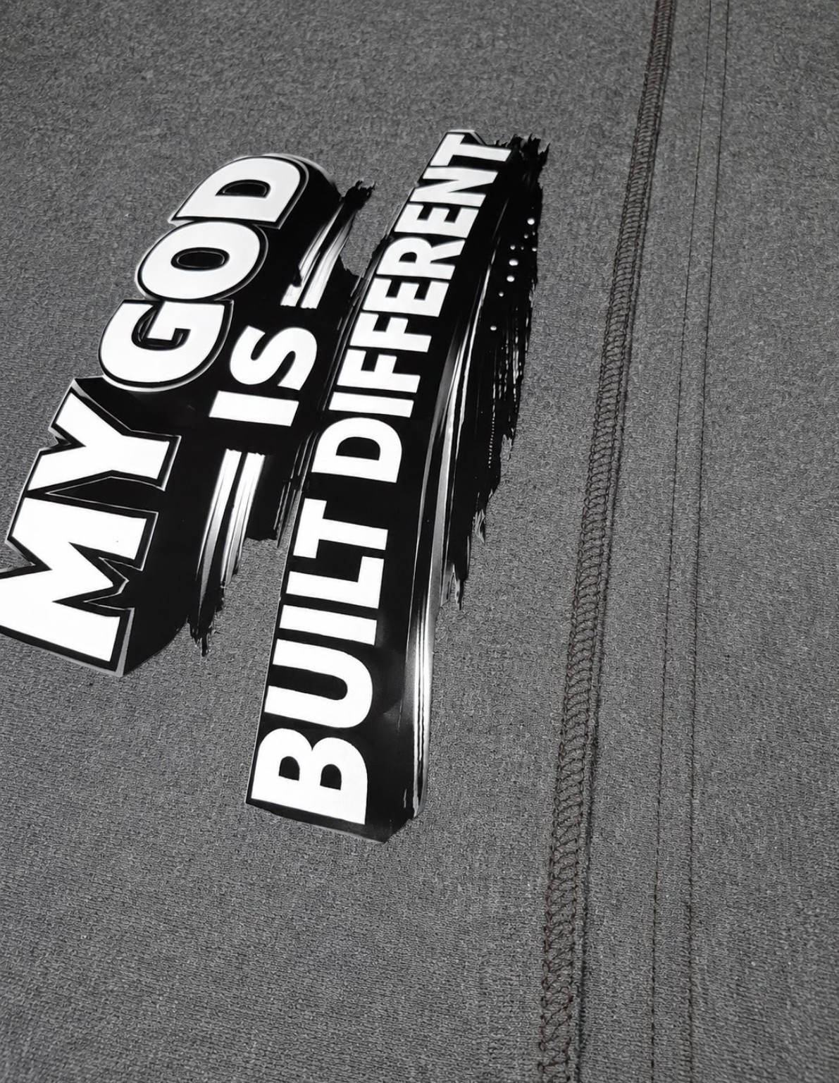 Q's Built Different collection of packaged shirts